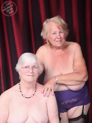 Two lesbians old granny posing for photograph